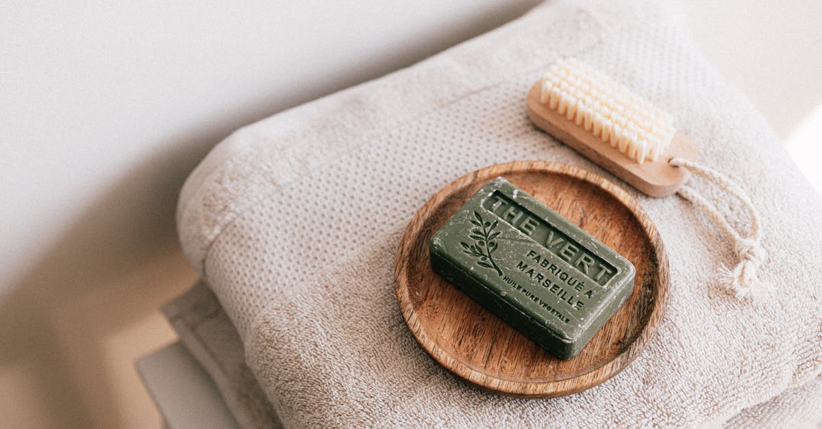 How to dry yourself after using the hand shower in the toilets? - Natural soap and brush on folded towels How to dry yourself after using the hand shower in the toilets? - Natural soap and brush on folded towels