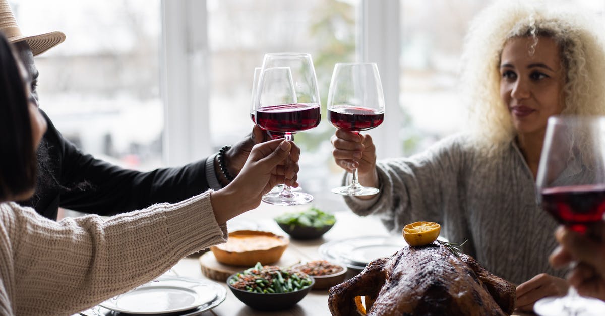 How to eat a meal with locals in Turkey? - Multiethnic people clinking glasses having dinner How to eat a meal with locals in Turkey? - Multiethnic people clinking glasses having dinner