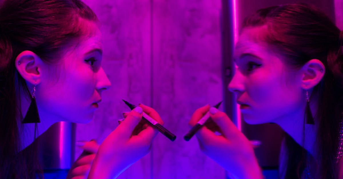How to fill out and apply for Subject Access Request (SAR)? - Side view of female with dark hair looking at reflection in mirror while applying makeup in room with neon light How to fill out and apply for Subject Access Request (SAR)? - Side view of female with dark hair looking at reflection in mirror while applying makeup in room with neon light