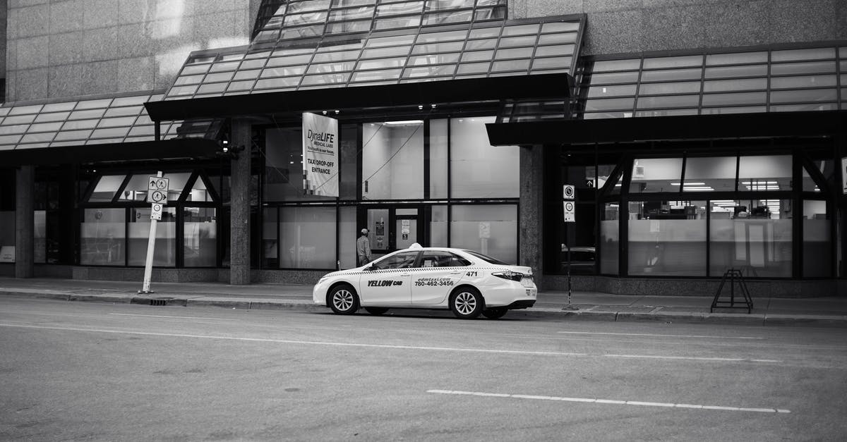 How to find a decent taxi company in Chicago? - Car Parked on Side of the Road Near Building How to find a decent taxi company in Chicago? - Car Parked on Side of the Road Near Building