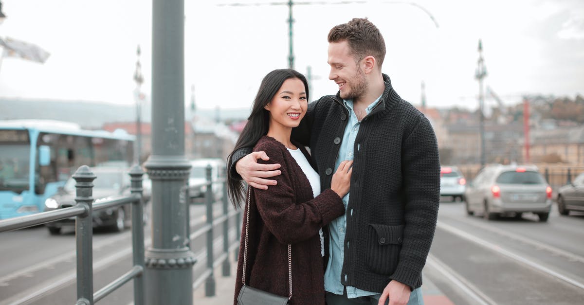 How to find all flights scheduled between a pair of cities? [duplicate] - Man and Woman Walking at the Sidewalk