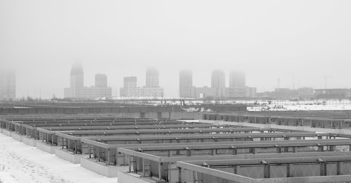 How to find cities with similar weather conditions - Black and white of industrial constructions in rows on snowy land against multistage buildings in town How to find cities with similar weather conditions - Black and white of industrial constructions in rows on snowy land against multistage buildings in town