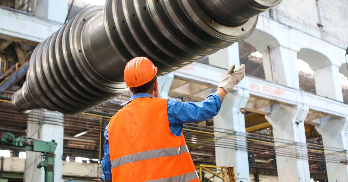 How to find high tech hotels in Hong Kong? - Man Standing Near Gray Metal Equipment How to find high tech hotels in Hong Kong? - Man Standing Near Gray Metal Equipment