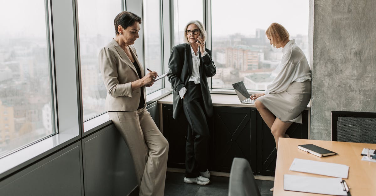 How to find out if a Canadian cellphone works abroad? [duplicate] - Woman in White Blazer Standing Beside Woman in White Blazer