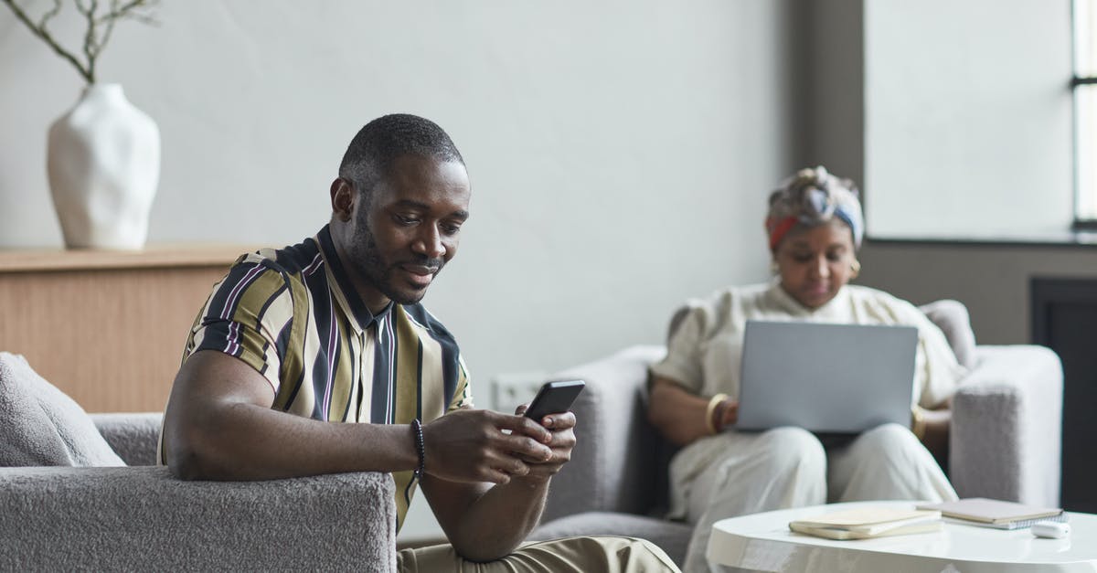 How to find out if a Canadian cellphone works abroad? [duplicate] - Man in Blue White and Yellow Stripe Polo Shirt Sitting on Gray Couch