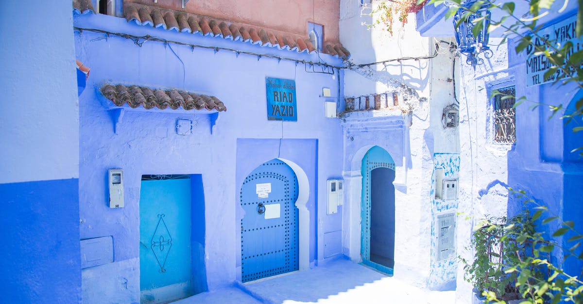 How to find the nearest location which has sunny forecast - Blue exterior of house with doors located under sunlight on street with green plants in city of Morocco in summer How to find the nearest location which has sunny forecast - Blue exterior of house with doors located under sunlight on street with green plants in city of Morocco in summer