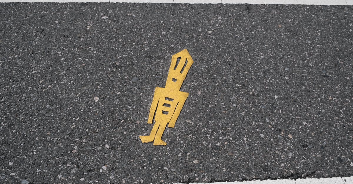 How to get a German Umweltzone sticker while on the road? [duplicate] - Yellow Sticker on Gray Concrete Pathway