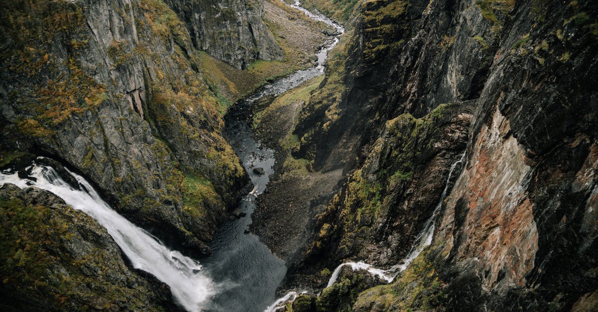 How to get from Caracas to Mount Roraima? - From above of powerful waterfall falling from rocky cliff in mountainous ravine in highland