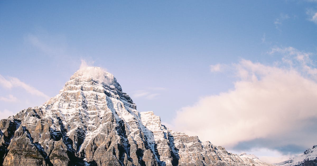 How to get from Caracas to Mount Roraima? - Snowy ridge in mountainous terrain under cloudy sky
