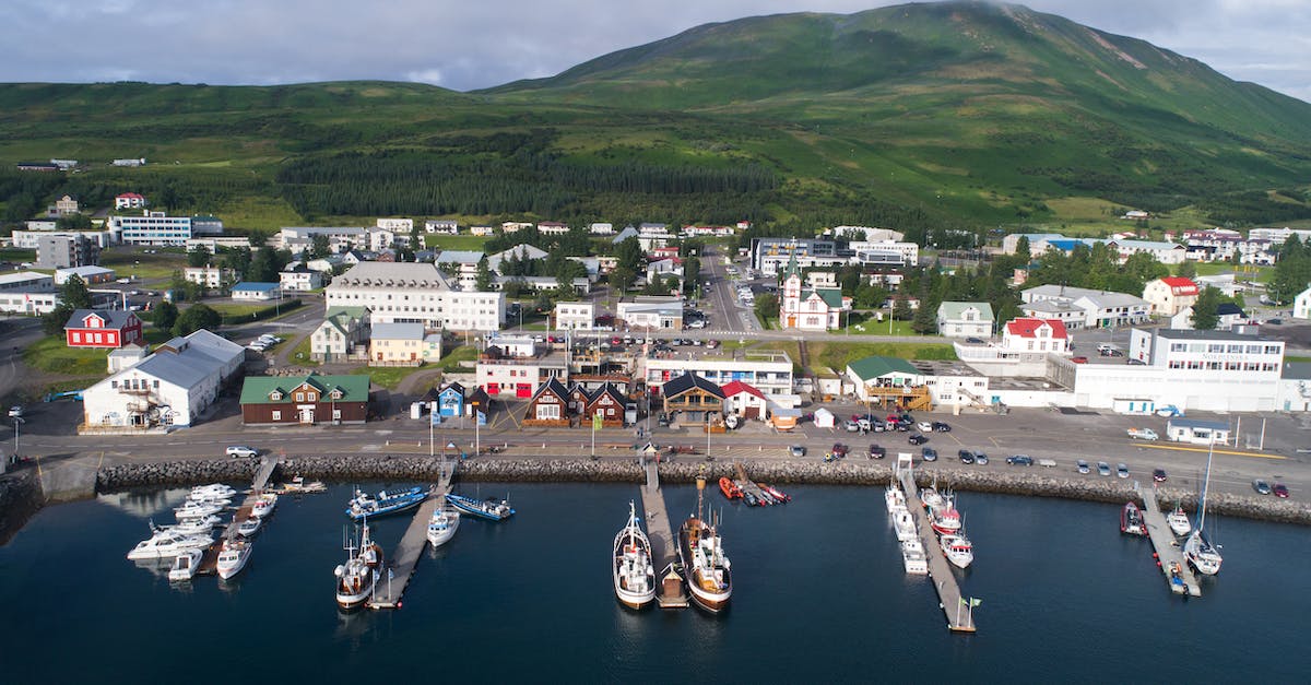 How to get from Iceland to Greenland? - Amazing view of Husavik harbor in Iceland in summertime How to get from Iceland to Greenland? - Amazing view of Husavik harbor in Iceland in summertime