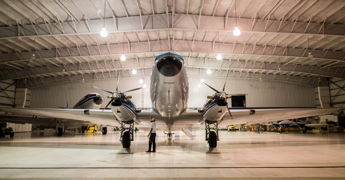 How to get from Macau to Hong Kong airport for an early morning flight - Gray Plane Inside Hangar How to get from Macau to Hong Kong airport for an early morning flight - Gray Plane Inside Hangar