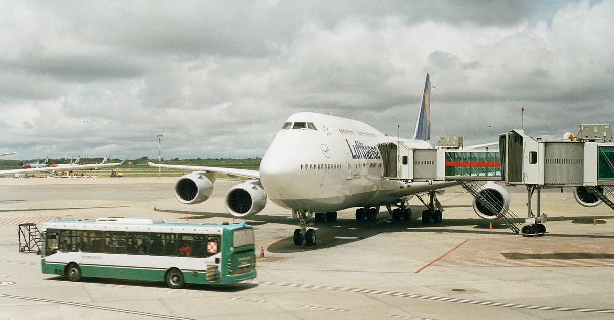 How to get from Nagoya Airport to Matsumoto by bus - Plane on Airport with Telescopic Corridor Attached and Bus Driving in front of It How to get from Nagoya Airport to Matsumoto by bus - Plane on Airport with Telescopic Corridor Attached and Bus Driving in front of It