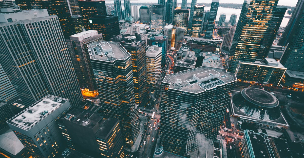 How to get from Toronto Downtown to Pearson Airport - Aerial Photo of City Commercial Buildings How to get from Toronto Downtown to Pearson Airport - Aerial Photo of City Commercial Buildings