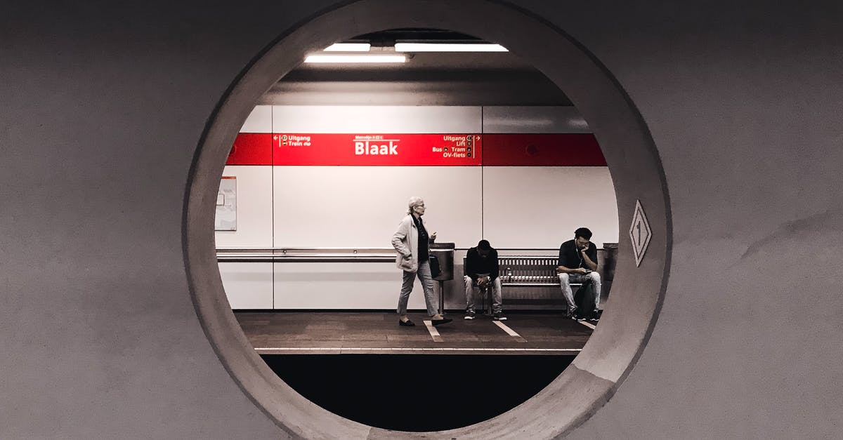 How to get in or out of an chipkaart-gated station with an e-ticket? [duplicate] - Grayscale Photography of People Waiting in Train Station