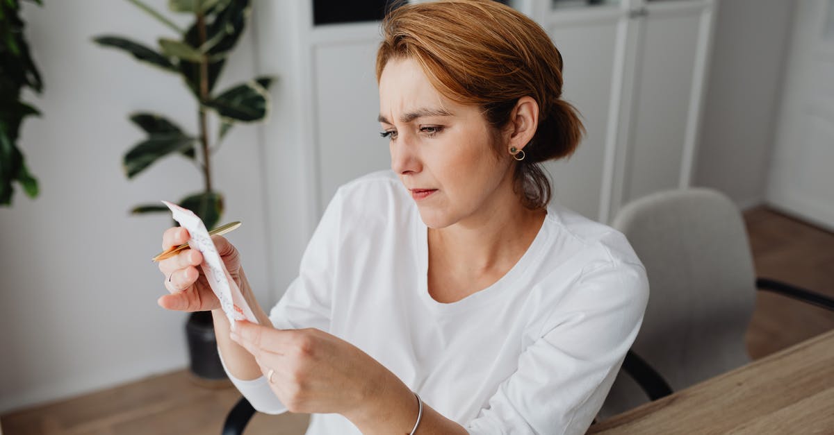 How to get itemized receipt from booking.com? - Woman at the Desk Looking at the ReceiptĀ How to get itemized receipt from booking.com? - Woman at the Desk Looking at the ReceiptĀ