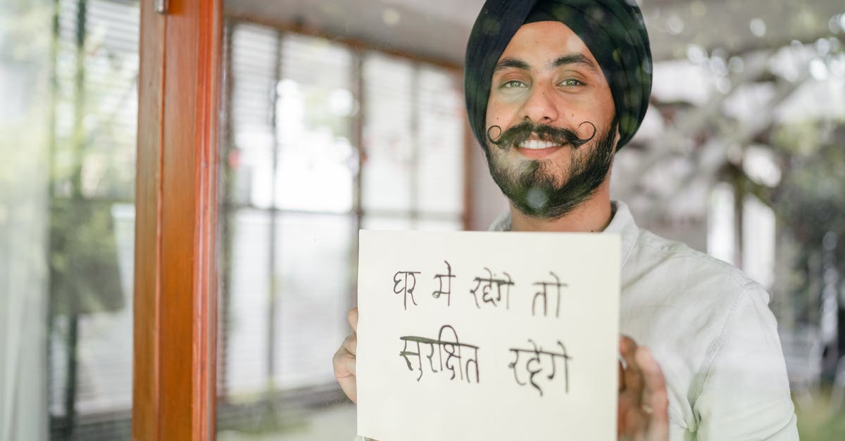 How to get safe through Mauritania - Content Indian guy showing paper with Hindi inscription How to get safe through Mauritania - Content Indian guy showing paper with Hindi inscription