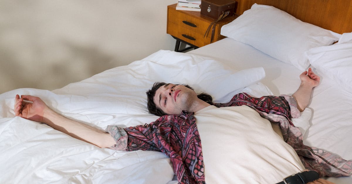 How to get the most out of a layover in Sao Paulo [closed] - Young Man Laying on Back in Bed and Chilling Out