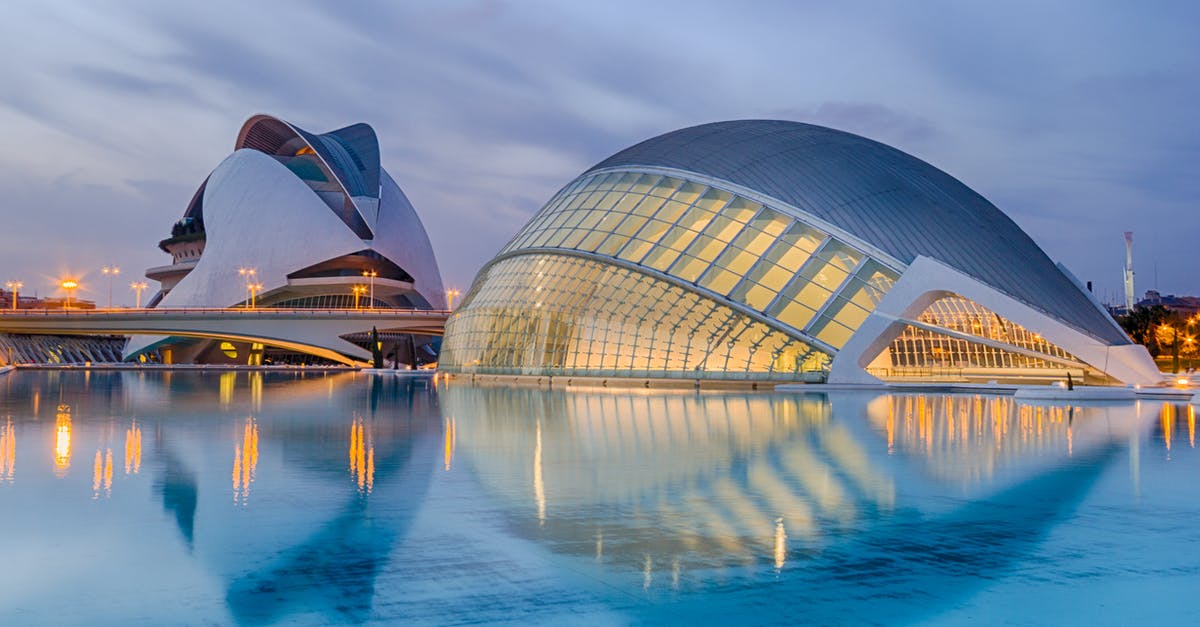 How to get to ALSA Bus Station Valencia from Valencia Airport? - Reflection of Cityscape in Sea at Night