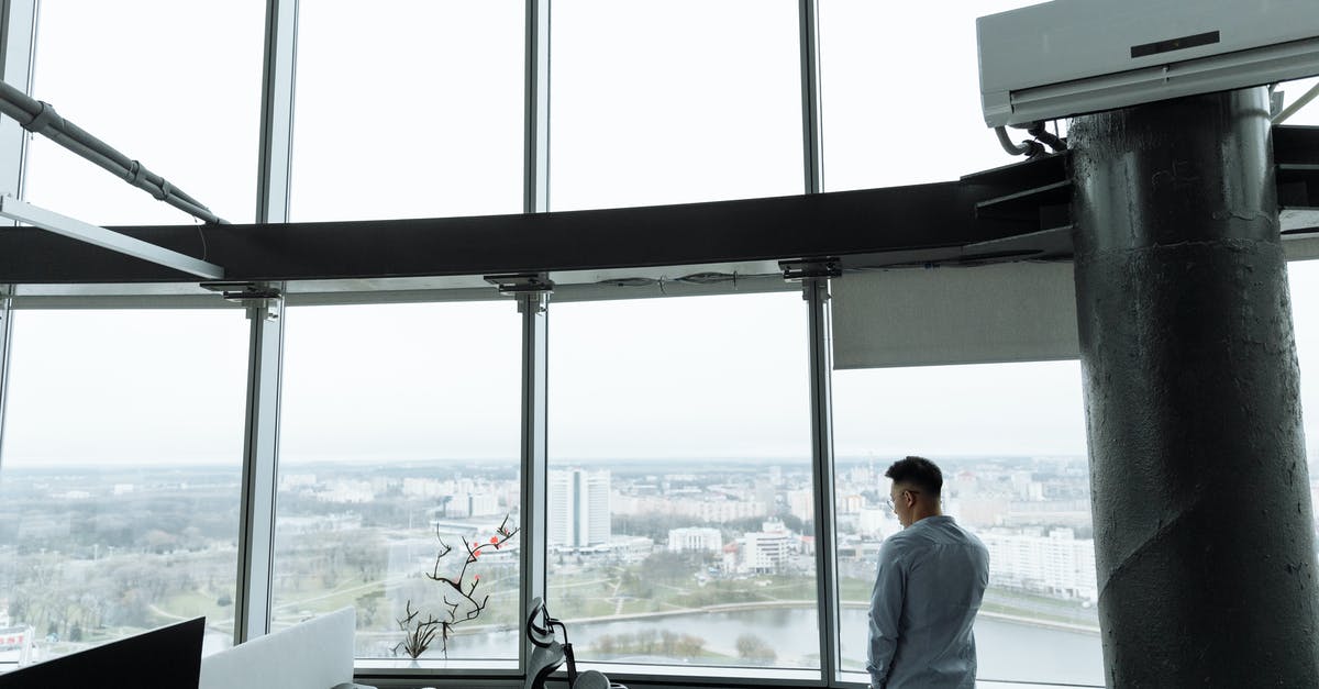 How to get to Antarctica without using a travel company - Man in White Dress Shirt Standing Near Window How to get to Antarctica without using a travel company - Man in White Dress Shirt Standing Near Window