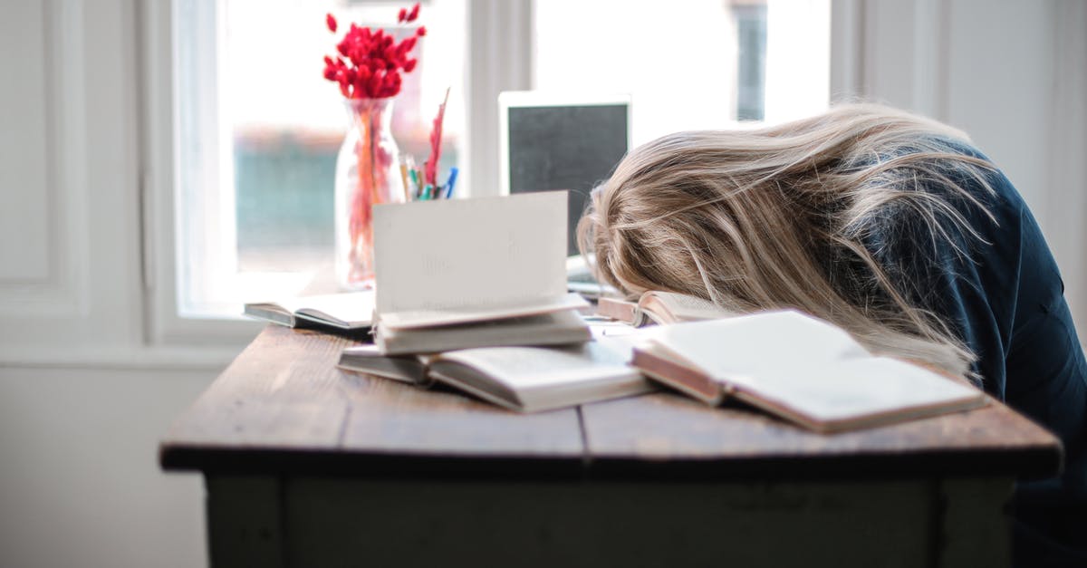 How to get work done on a train, if I am easily distracted by others? - Woman Leaning on Table How to get work done on a train, if I am easily distracted by others? - Woman Leaning on Table