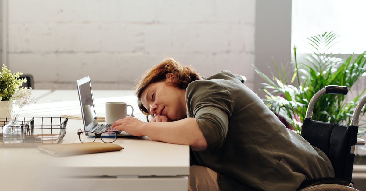 How to get work done on a train, if I am easily distracted by others? - Woman Leaning on Her Table How to get work done on a train, if I am easily distracted by others? - Woman Leaning on Her Table