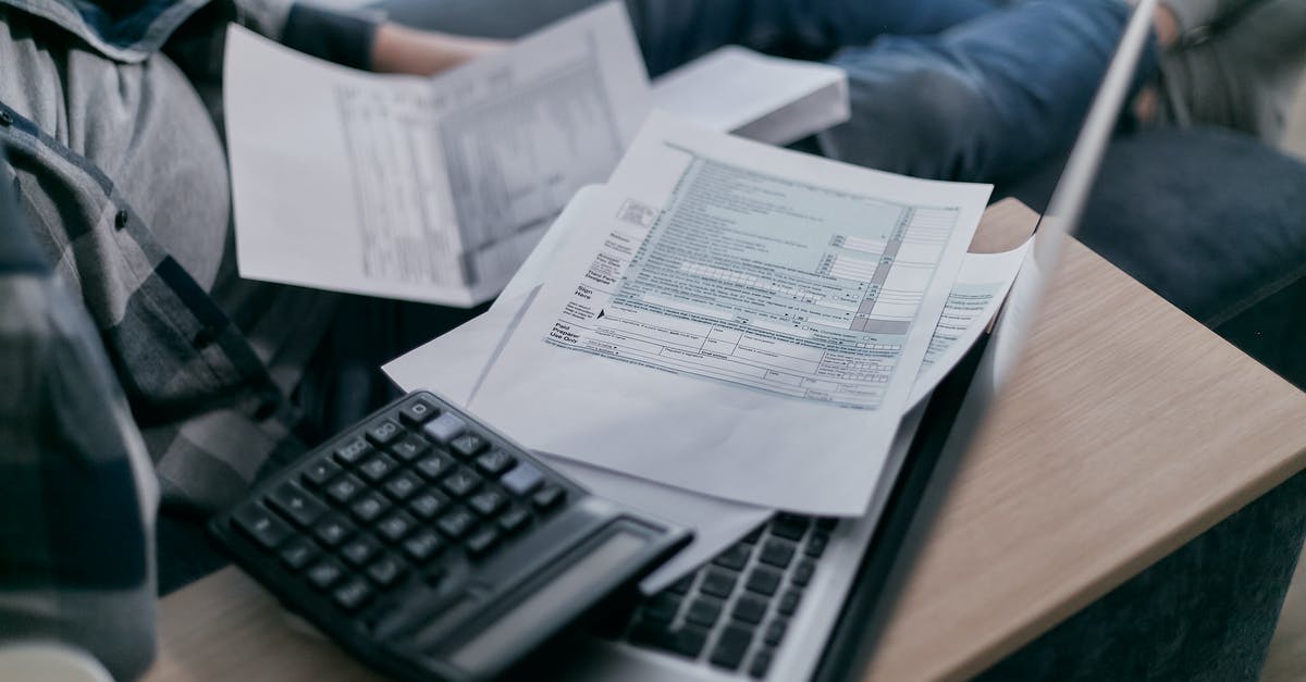 How to go about paying bills at home during an overseas trip? - White Printer Paper on Brown Wooden Table How to go about paying bills at home during an overseas trip? - White Printer Paper on Brown Wooden Table
