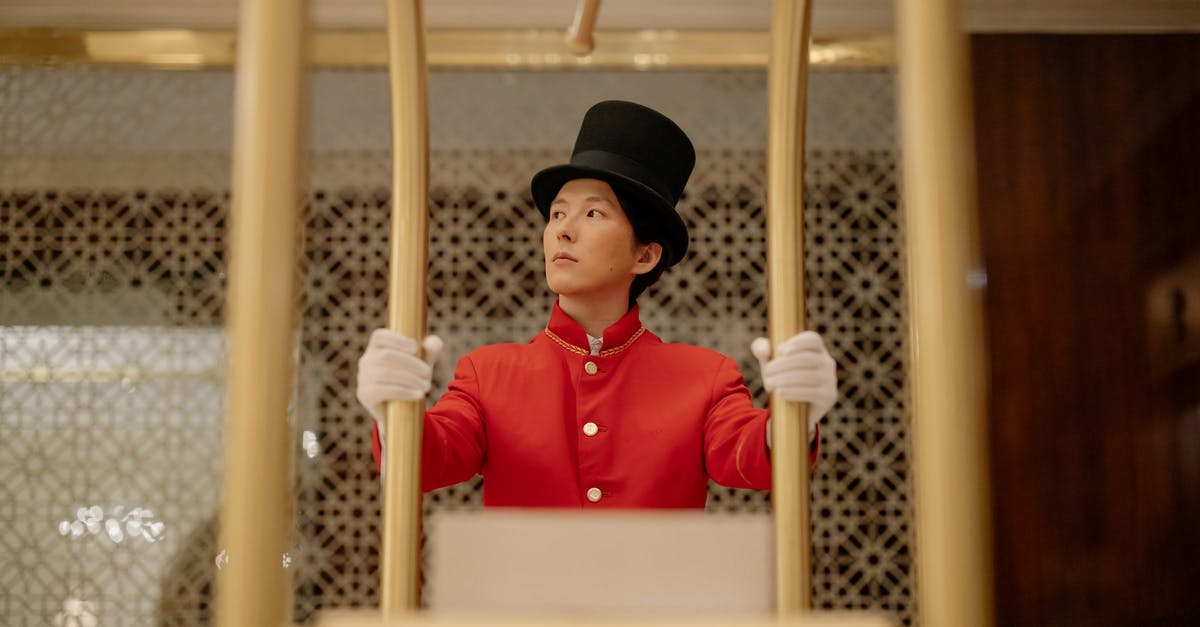 How to Help Hotel Amend a Booking? - Man Pushing the Cart with White Boxes How to Help Hotel Amend a Booking? - Man Pushing the Cart with White Boxes