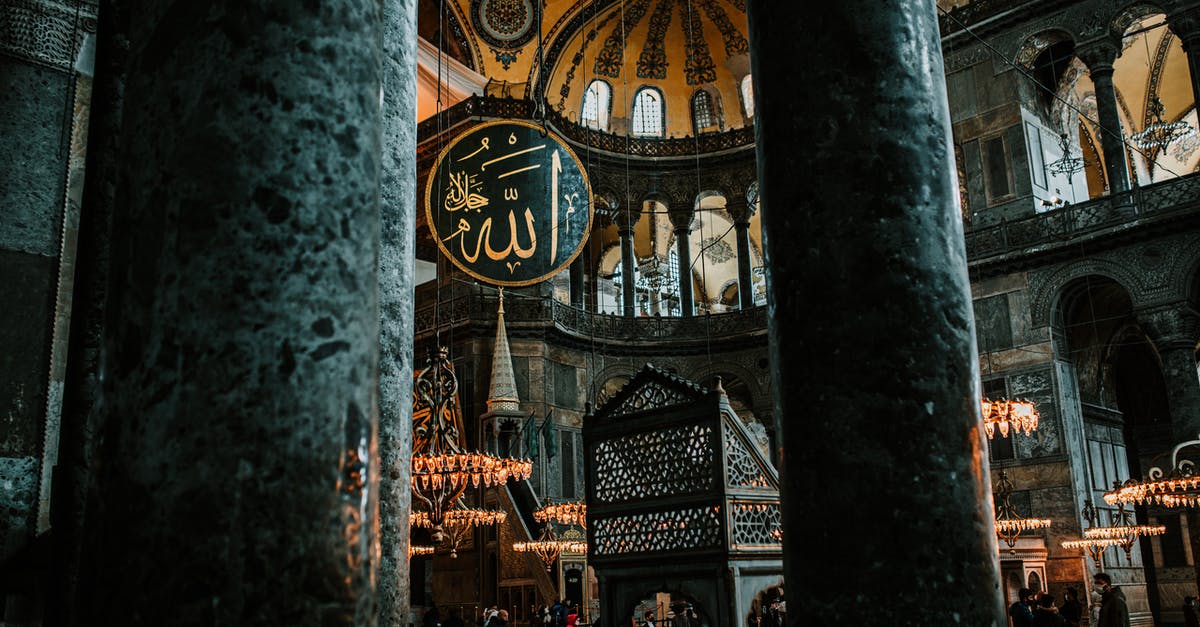 How to help someone from Turkey obtain a 3 week tourist visa to visit the UK with a letter of invitation - Interior of aged mosque with columns and rich decorated walls