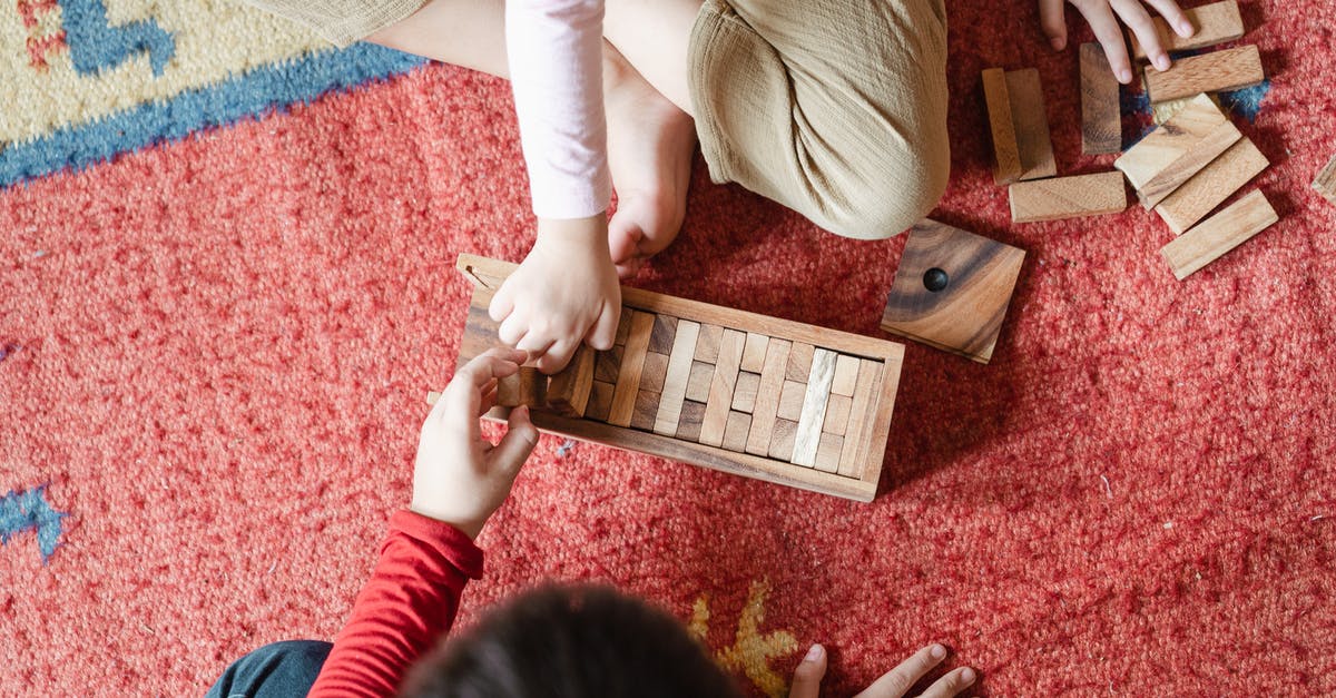 How to improve the chances of getting a free ticket from a "Blue Girl" at the Bayreuth Festival? - Top view of anonymous barefoot boy and girl in casual clothes sitting on floor carpet and playing with wooden blocks of jenga tower game How to improve the chances of getting a free ticket from a "Blue Girl" at the Bayreuth Festival? - Top view of anonymous barefoot boy and girl in casual clothes sitting on floor carpet and playing with wooden blocks of jenga tower game