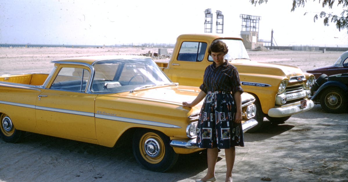 How to independently visit Saudi Arabia? - Woman in Black and White Floral Dress Leaning on Yellow Car How to independently visit Saudi Arabia? - Woman in Black and White Floral Dress Leaning on Yellow Car