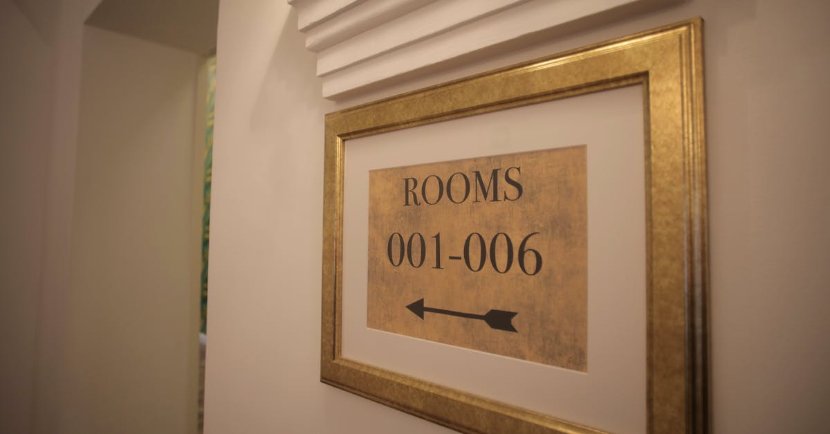 How to indicate the tip to cleaners in hotels and motels [duplicate] - Sign with rooms numbers hanging on white wall in modern hotel