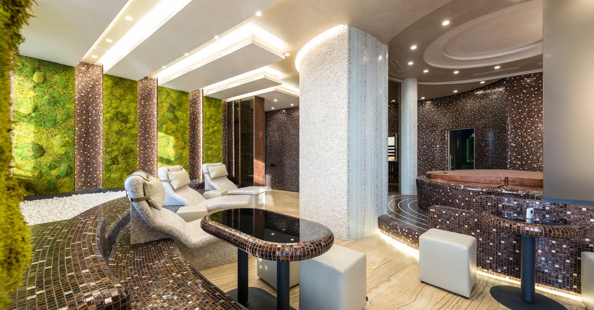 How to interpret austrian sauna timetables - Comfortable chairs and bathtubs in spacious contemporary spa center with mosaic elements and walls decorated with fresh green plants How to interpret austrian sauna timetables - Comfortable chairs and bathtubs in spacious contemporary spa center with mosaic elements and walls decorated with fresh green plants