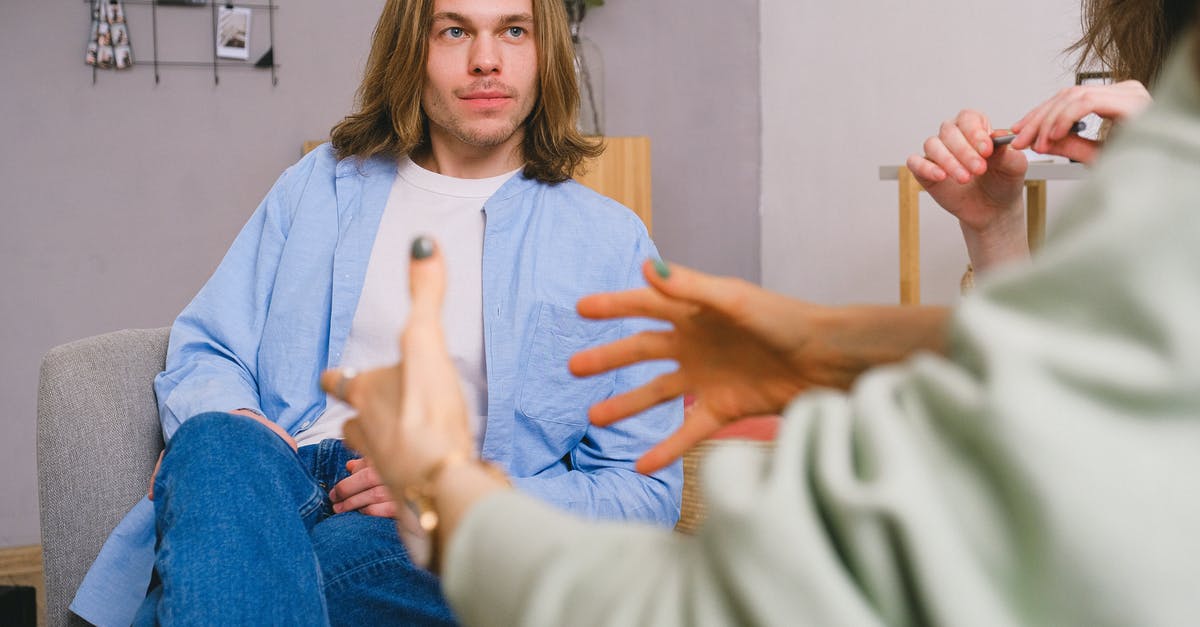 How to invite my partner to visit me in the UK? - Crop psychologist supporting couple during appointment How to invite my partner to visit me in the UK? - Crop psychologist supporting couple during appointment