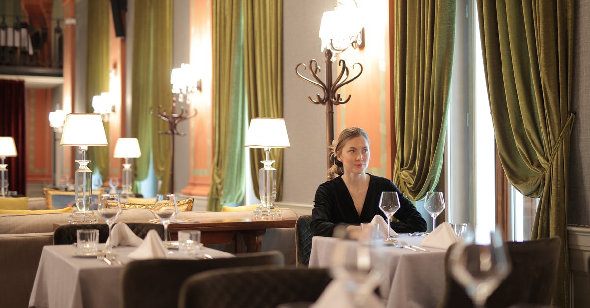 How to make dining alone less awkward? - Woman In A Restaurant Sitting Alone How to make dining alone less awkward? - Woman In A Restaurant Sitting Alone