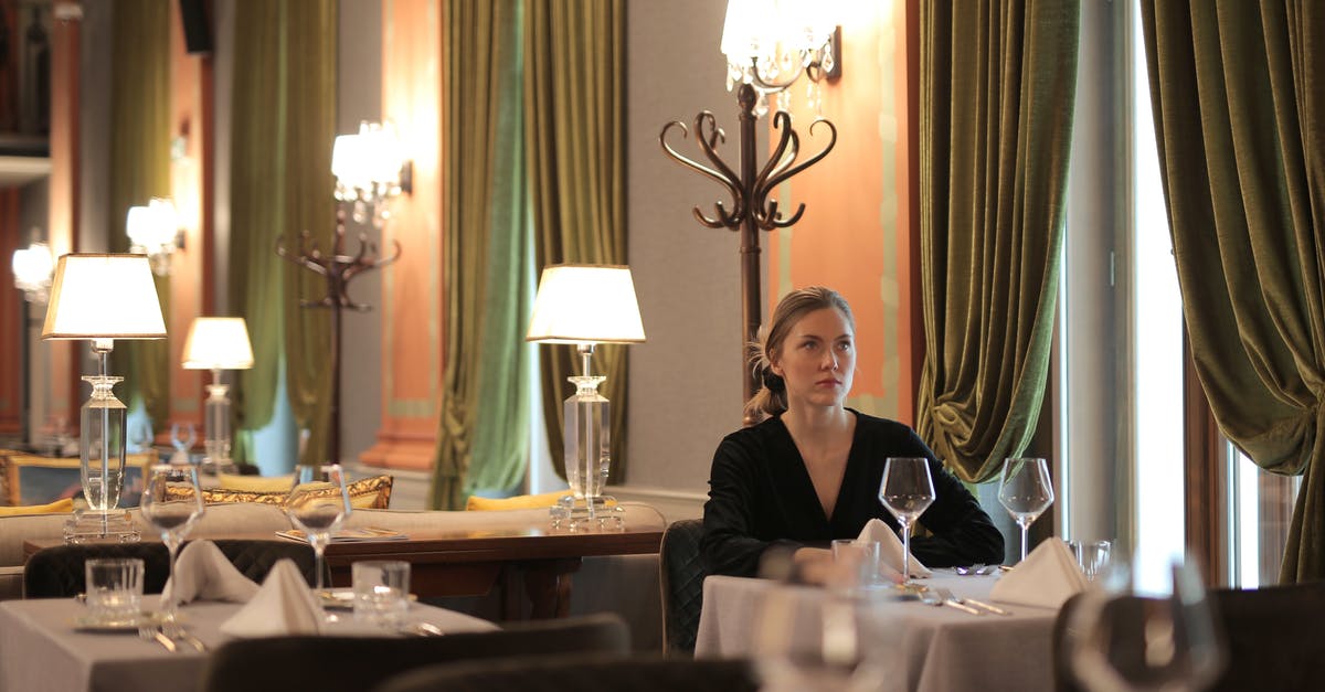 How to make dining alone less awkward? - Woman Sitting Alone In A Restaurant How to make dining alone less awkward? - Woman Sitting Alone In A Restaurant