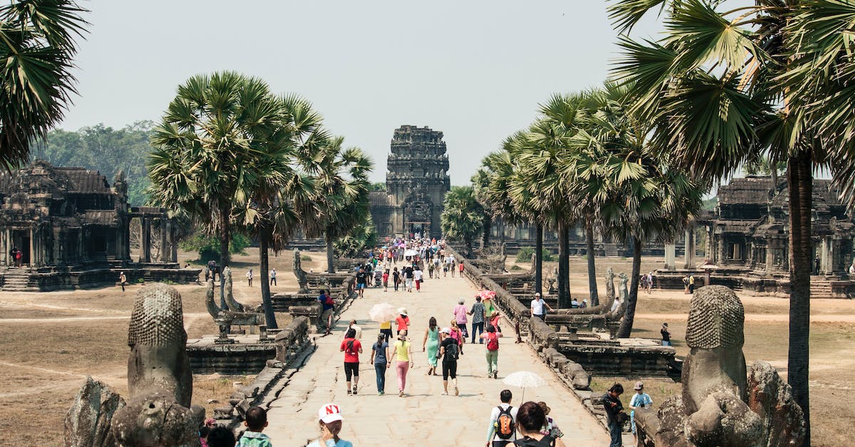 How to obtain a Cambodia tourist visa in Bangkok? - Crowd of people strolling along paved walkway of ancient Angkor Wat in Cambodia How to obtain a Cambodia tourist visa in Bangkok? - Crowd of people strolling along paved walkway of ancient Angkor Wat in Cambodia
