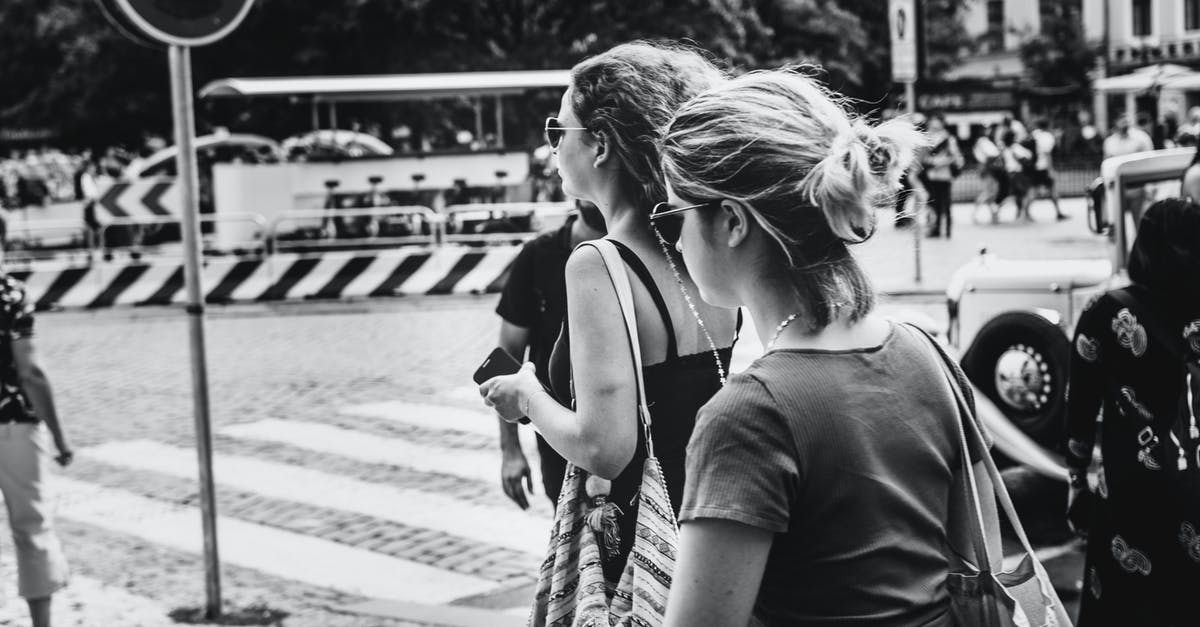 How to pick a walking tour group, when there's a choice? - Grayscale Photo of People Walking on The Street How to pick a walking tour group, when there's a choice? - Grayscale Photo of People Walking on The Street