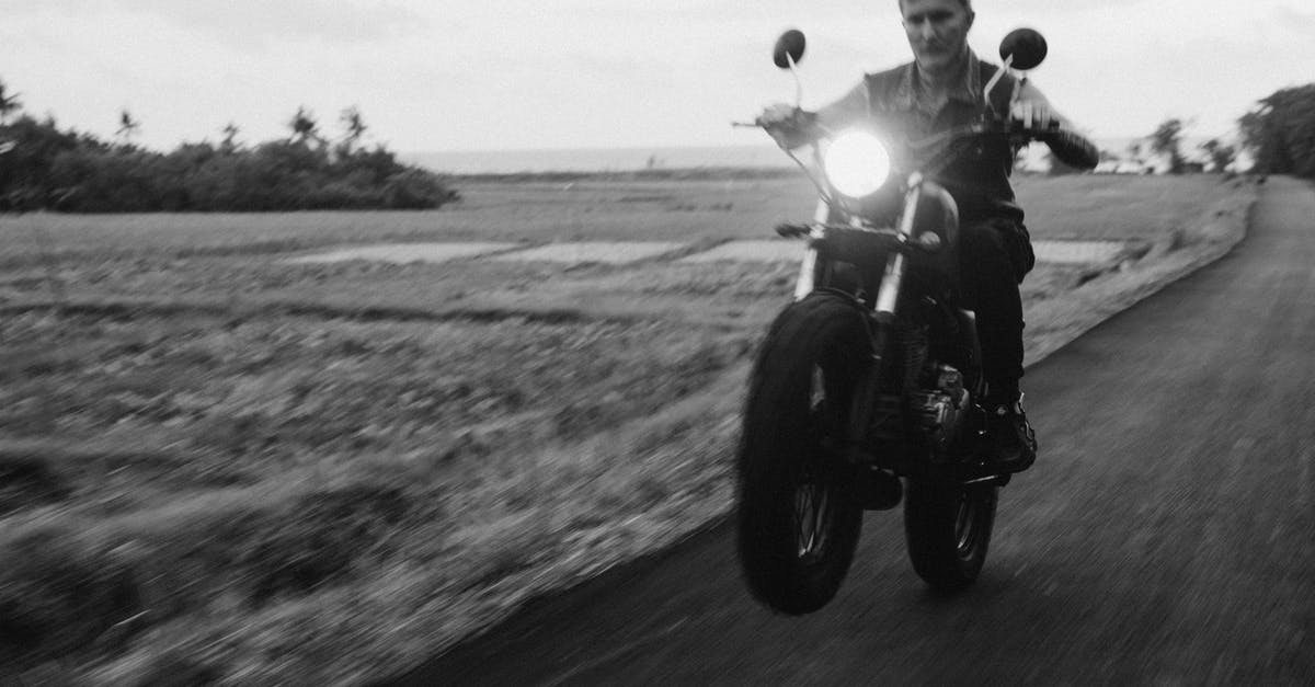 How to Plan a Route for Long Distance Bike Trip In Europe - Biker riding motorbike on asphalt road under cloudy sky How to Plan a Route for Long Distance Bike Trip In Europe - Biker riding motorbike on asphalt road under cloudy sky