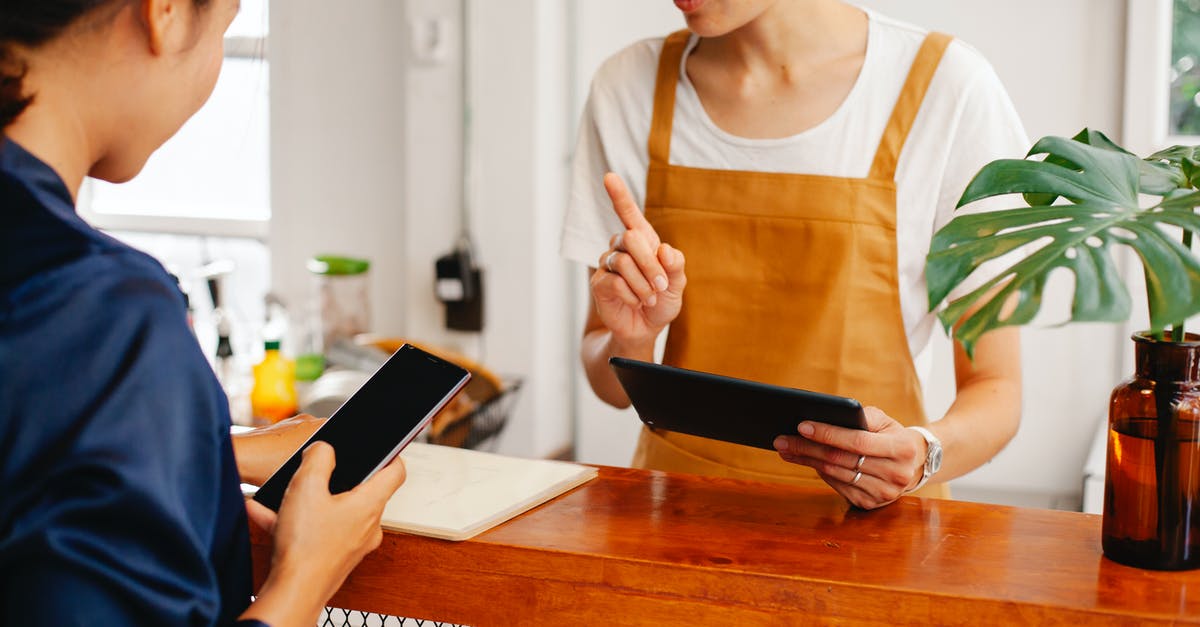 How to politely indicate that you only speak English and would like to continue in it? - Crop anonymous female employee with finger up speaking with partner touching black screen on cellphone in cafe How to politely indicate that you only speak English and would like to continue in it? - Crop anonymous female employee with finger up speaking with partner touching black screen on cellphone in cafe