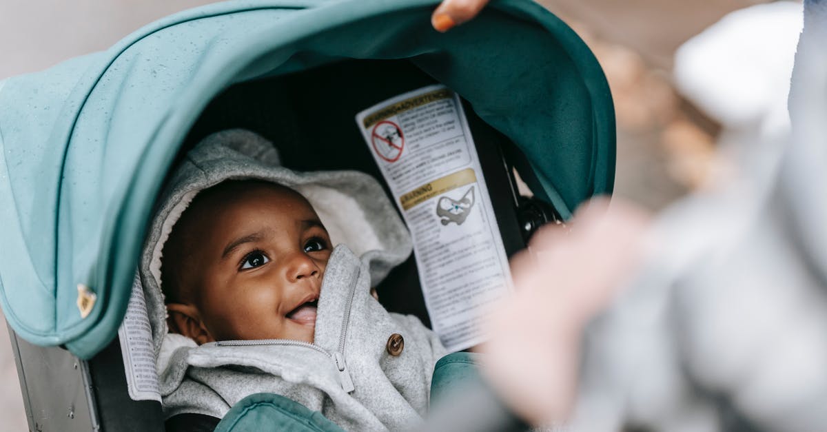 How to prove mother-child relationship for baby passport if mother's name on birth certificate is different from current legal name? - Smiling cute ethnic baby in stroller with parents