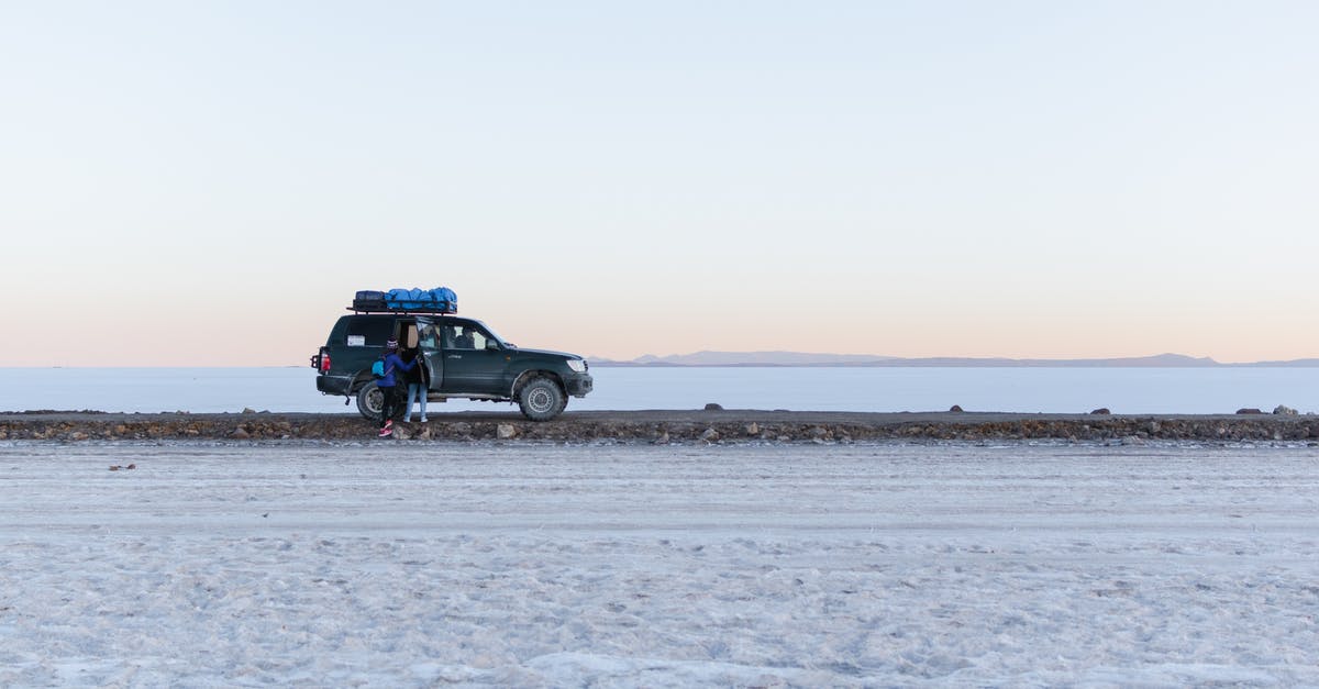 How to reach Salar de Uyuni from Potosí or Sucre (Bolivia)? - Black Suv on Gray Sand How to reach Salar de Uyuni from Potosí or Sucre (Bolivia)? - Black Suv on Gray Sand