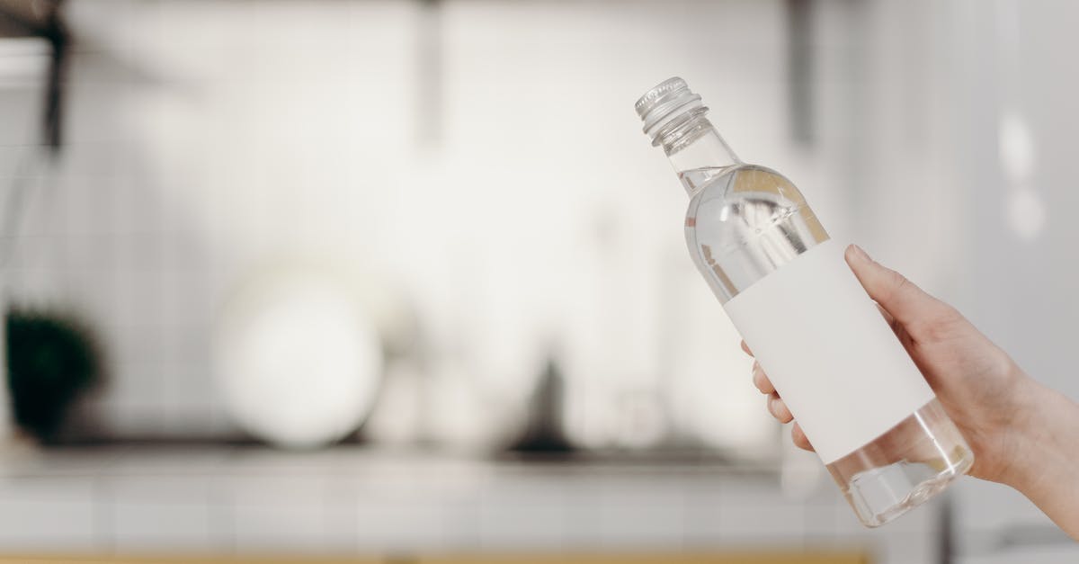 How to remove airlines/security tag stickers from suitcases? - Clear Glass Bottle With White Cap How to remove airlines/security tag stickers from suitcases? - Clear Glass Bottle With White Cap