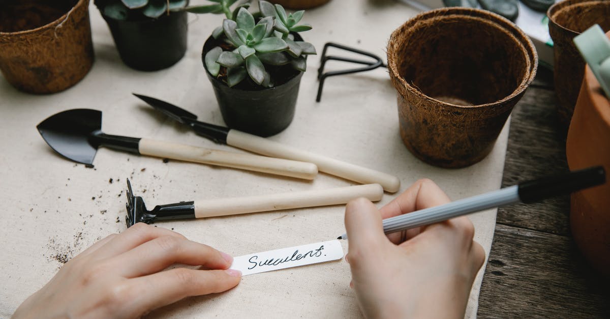 How to remove airlines/security tag stickers from suitcases? - Gardener preparing tag for potted plant How to remove airlines/security tag stickers from suitcases? - Gardener preparing tag for potted plant