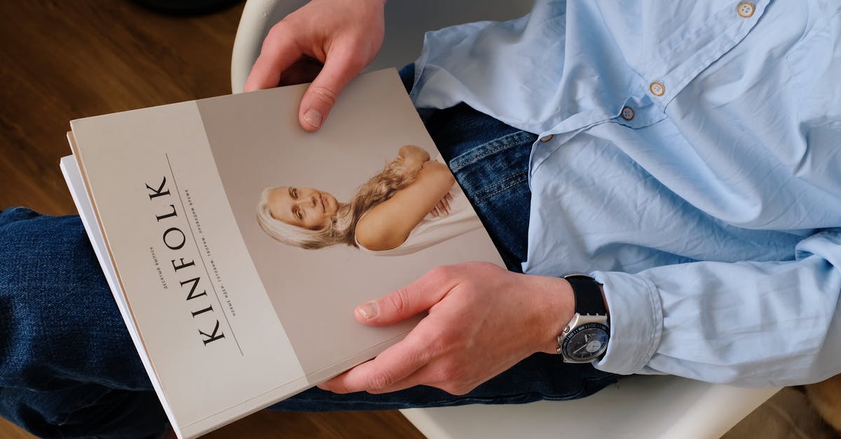 How to search for a late checkout hotel? - From above of unrecognizable man in casual clothes resting with magazine Kinfolk on knees while sitting on chair in modern studio How to search for a late checkout hotel? - From above of unrecognizable man in casual clothes resting with magazine Kinfolk on knees while sitting on chair in modern studio
