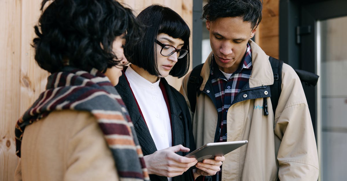 How to search for a late checkout hotel? - Man in Brown Coat Holding Black Tablet Computer How to search for a late checkout hotel? - Man in Brown Coat Holding Black Tablet Computer