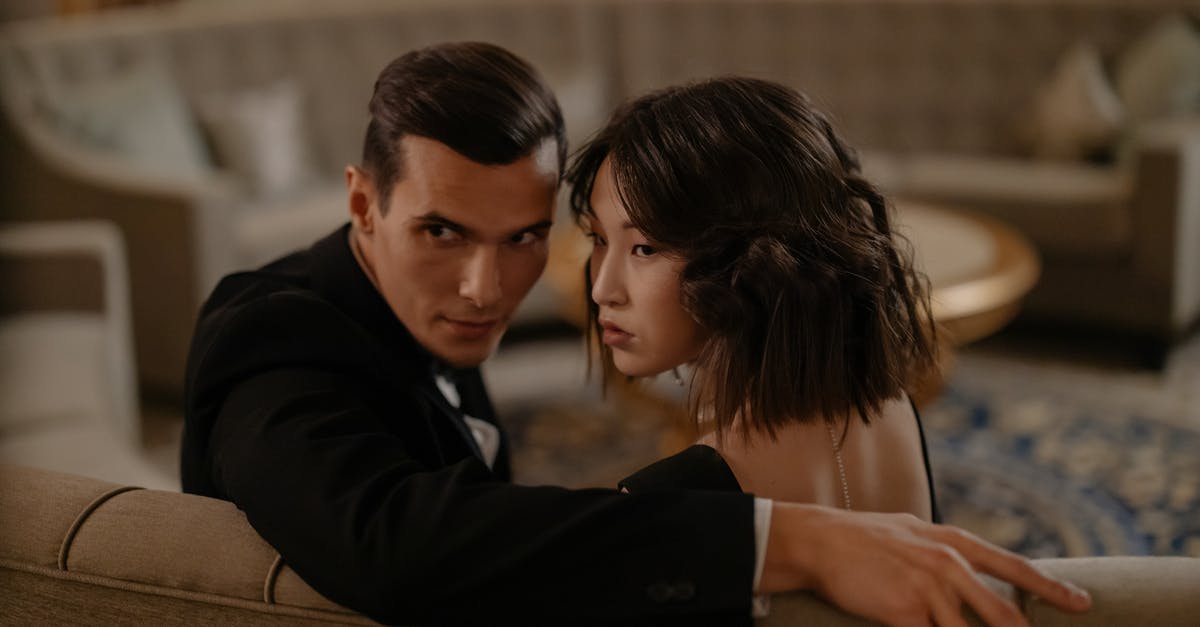 How to search for hotel rooms with suites (two or more rooms joined together) on Booking.com? - Man in Black Suit Jacket Sitting Beside Woman in Black Dress How to search for hotel rooms with suites (two or more rooms joined together) on Booking.com? - Man in Black Suit Jacket Sitting Beside Woman in Black Dress
