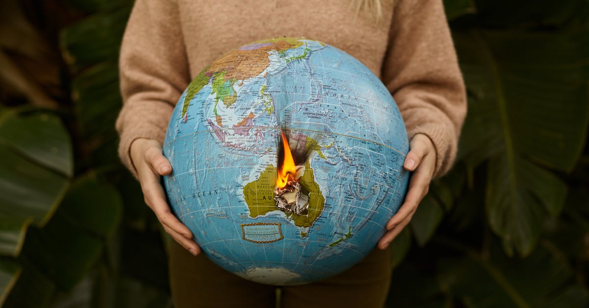 How to show Australia ETA proof at Taiwan entry? - Crop woman with burning globe in hands How to show Australia ETA proof at Taiwan entry? - Crop woman with burning globe in hands