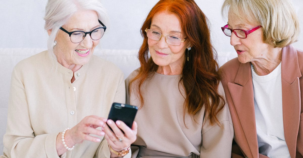 How to show share proceeds in bank statements for UK visa - Senior happy women watching video online in smartphone