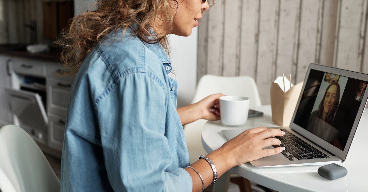 How to stay connected with friends, family while abroad? - Woman in Blue Denim Jacket Using Macbook Pro How to stay connected with friends, family while abroad? - Woman in Blue Denim Jacket Using Macbook Pro