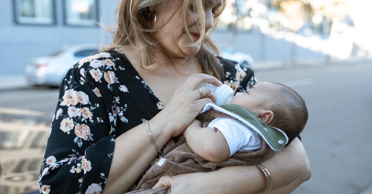 How to sterilize infant feeding bottles while traveling? - A Mother Carrying Her Baby while Feeding Using a Milk Bottle How to sterilize infant feeding bottles while traveling? - A Mother Carrying Her Baby while Feeding Using a Milk Bottle